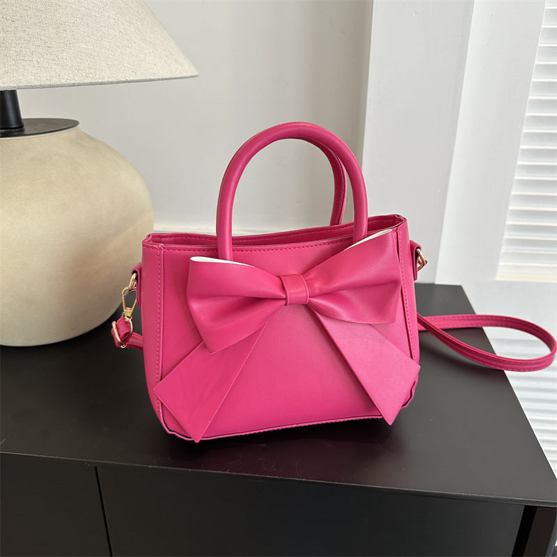 Elegante quadratische Handtasche mit XXL-Schleife